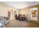 Spacious living room featuring a formal dining table and an entryway at 1708 W Dusty Wren Dr, Phoenix, AZ 85085