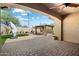 Covered patio with brick pavers, outdoor gazebo with white curtains, and outdoor living space at 1708 W Dusty Wren Dr, Phoenix, AZ 85085