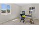 Modern bedroom with wood floors, a neutral palette, and plenty of natural light from two windows at 171 W Tulsa St, Chandler, AZ 85225