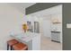 Modern kitchen featuring stainless steel appliances, white cabinetry, and a view into the dining room at 171 W Tulsa St, Chandler, AZ 85225