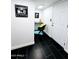 Laundry room area featuring black tile floors, a desk, and decor, combining utility with a stylish workspace at 171 W Tulsa St, Chandler, AZ 85225