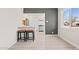 Open-concept living space with bright bar stool seating and a view into the renovated kitchen at 171 W Tulsa St, Chandler, AZ 85225