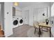 This versatile laundry room has a pair of appliances and a small work area at 1717 E Sandra Ter, Phoenix, AZ 85022