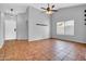 Spacious living room with tile floors, ceiling fan and high ceilings at 1717 E Sandra Ter, Phoenix, AZ 85022