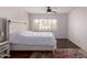 Bedroom featuring a white bed with storage drawers and a ceiling fan at 1725 W Marlette Ave, Phoenix, AZ 85015