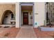 Close-up of the front door with security gate and desert landscaping at 1725 W Marlette Ave, Phoenix, AZ 85015