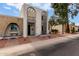 Inviting exterior view of a well-kept home with an arched facade and desert landscaping at 1725 W Marlette Ave, Phoenix, AZ 85015