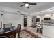 Open kitchen and dining area with stainless steel appliances, granite counters, and recessed lighting at 1725 W Marlette Ave, Phoenix, AZ 85015