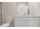 Bathroom featuring toilet and white vanity with marble countertop and stainless steel faucet at 17735 W Brown St, Waddell, AZ 85355