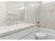 Elegant bathroom with marble-style walls, white cabinetry, and modern fixtures at 17735 W Brown St, Waddell, AZ 85355