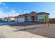 Beautiful single-story home with a three-car garage and low maintenance landscaping at 17735 W Brown St, Waddell, AZ 85355