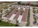 Aerial view of meticulously maintained bocce ball courts surrounded by lush landscaping, promoting leisure and recreation at 18016 E Wolf Tree Ln, Rio Verde, AZ 85263