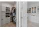 Walk-in closet with custom shelving and drawers, maximizing storage space and organization at 18016 E Wolf Tree Ln, Rio Verde, AZ 85263