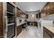 Spacious laundry room with modern washer/dryer, wine cooler, extensive cabinetry, and counter space at 18016 E Wolf Tree Ln, Rio Verde, AZ 85263