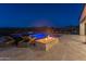 Modern backyard pool with a fire pit feature and lounge chairs at 18016 E Wolf Tree Ln, Rio Verde, AZ 85263