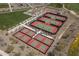 Aerial view of meticulously maintained tennis courts with vibrant green surfaces, promoting an active and social lifestyle at 18016 E Wolf Tree Ln, Rio Verde, AZ 85263