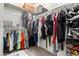 Organized walk-in closet with ample hanging space and shelving for storage at 18146 W Tina Ln, Surprise, AZ 85387