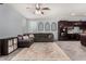 Open-concept living room featuring tile floors, modern windows, and seamlessly connected kitchen at 18146 W Tina Ln, Surprise, AZ 85387