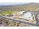 Aerial view of a community school with sports fields, parking, and surrounding residential neighborhood at 1828 W Hemingway Ln, Anthem, AZ 85086