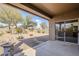 Entertaining backyard features a covered patio and low-maintenance desert landscaping at 1828 W Hemingway Ln, Anthem, AZ 85086