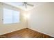 Cozy bedroom features natural light from the window and vinyl wood-look flooring at 1828 W Hemingway Ln, Anthem, AZ 85086