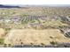 Aerial shot showcasing community sports facilities with pool, tennis courts, and open green spaces at 1828 W Hemingway Ln, Anthem, AZ 85086