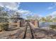 Scenic view of a train track leading to a covered structure by a pond in a well-maintained community park at 1828 W Hemingway Ln, Anthem, AZ 85086