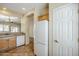 View of the kitchen with tan cabinets, granite countertops and appliances at 1828 W Hemingway Ln, Anthem, AZ 85086