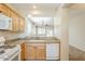 Kitchen with a view to the dining room and appliances including a gas stove and dishwasher at 1828 W Hemingway Ln, Anthem, AZ 85086