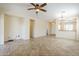 Spacious living room features tile flooring, ceiling fan, and open layout at 1828 W Hemingway Ln, Anthem, AZ 85086