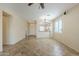 View of the open living room with tile floors and views to the kitchen at 1828 W Hemingway Ln, Anthem, AZ 85086