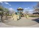 Community playground area features a covered play structure with slides and climbing features for outdoor enjoyment at 1828 W Hemingway Ln, Anthem, AZ 85086