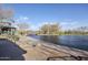 Lakeside community park with covered pavilion overlooking a pond with bridge and lush greenery and ducks at 1828 W Hemingway Ln, Anthem, AZ 85086