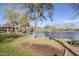 Community pond with grassy banks, mature shade trees, a gazebo, and a fountain with ducks at 1828 W Hemingway Ln, Anthem, AZ 85086