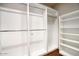 Walk-in closet with custom shelving and ample storage provides an organized and spacious solution at 18720 N 101St St # 3021, Scottsdale, AZ 85255