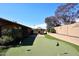 Manicured backyard with putting green, charming gazebo, and lush greenery at 1920 E Manzanita Dr, Phoenix, AZ 85020