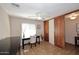 Bedroom with tile flooring, a ceiling fan, and sliding wood closet doors at 1920 E Manzanita Dr, Phoenix, AZ 85020