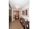 Home foyer featuring tile flooring, a decorative front door, and a rustic console table at 1920 E Manzanita Dr, Phoenix, AZ 85020