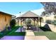 Backyard gazebo offering a shaded seating area with lush landscaping around at 1920 E Manzanita Dr, Phoenix, AZ 85020