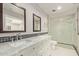 Modern bathroom with a double vanity, marble countertops, and glass-enclosed shower at 1974 E Vinedo Ln, Tempe, AZ 85284