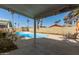 Inviting backyard pool and patio area with views of tall palm trees at 1974 E Vinedo Ln, Tempe, AZ 85284