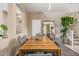 Charming dining room showcasing a wooden table, gray upholstered chairs, and a large mirror enhancing the space at 2013 N 77Th Gln, Phoenix, AZ 85035