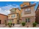 View of the side of the home, showcasing the stone accents and tile roofing at 2013 N 77Th Gln, Phoenix, AZ 85035