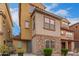 Charming two-story home featuring stone accents, neutral colors, and a tile roof at 2013 N 77Th Gln, Phoenix, AZ 85035