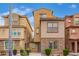 Charming two-story home featuring stone accents and well-maintained landscaping under a bright blue sky at 2013 N 77Th Gln, Phoenix, AZ 85035