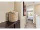 Hallway with a decorative basket and a glimpse of a bedroom at 2013 N 77Th Gln, Phoenix, AZ 85035