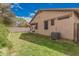 Spacious backyard featuring lush green grass, a sturdy fence, and a blue sky overhead at 20916 E Desert Hills Blvd, Queen Creek, AZ 85142