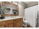 Charming bathroom featuring a wooden framed mirror and neutral color palette at 20916 E Desert Hills Blvd, Queen Creek, AZ 85142