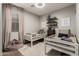 Neutral ' bedroom with twin beds, soft rug, toys and shelves at 20916 E Desert Hills Blvd, Queen Creek, AZ 85142