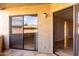 View of balcony showing sliding glass doors and light fixture at 2228 N 52Nd St # 117, Phoenix, AZ 85008